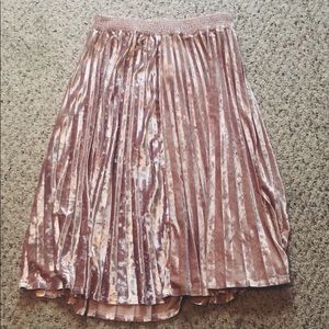 Long, pink, and velvet skirt.
